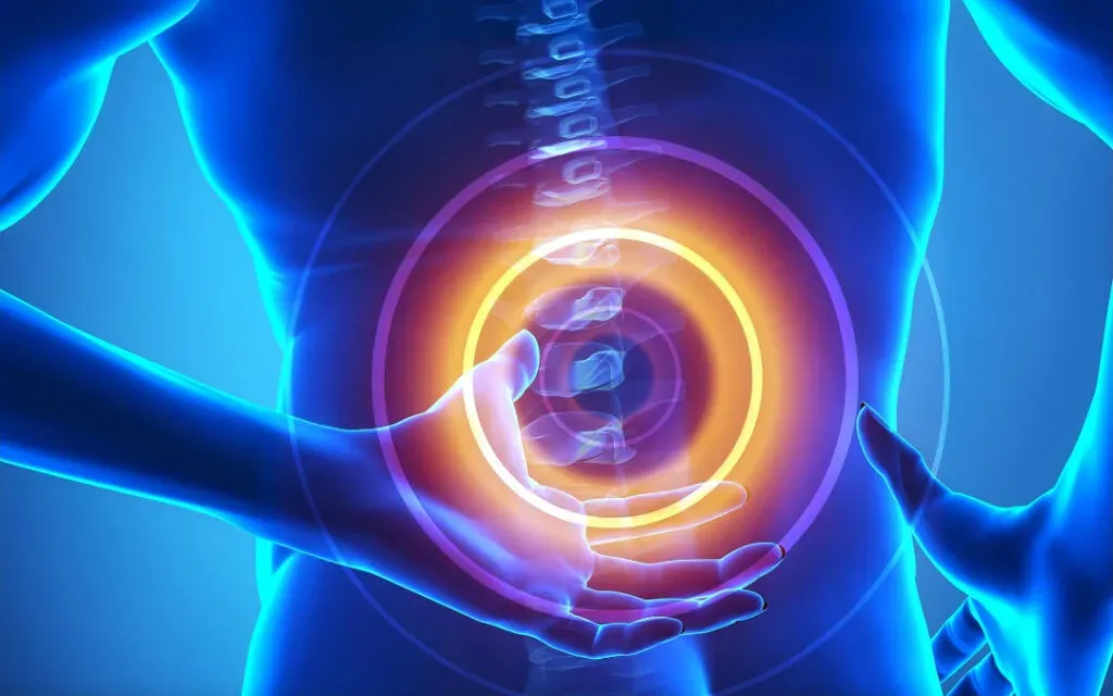A blue medical illustration of a person clutching their lower back with the spine glowing in pain