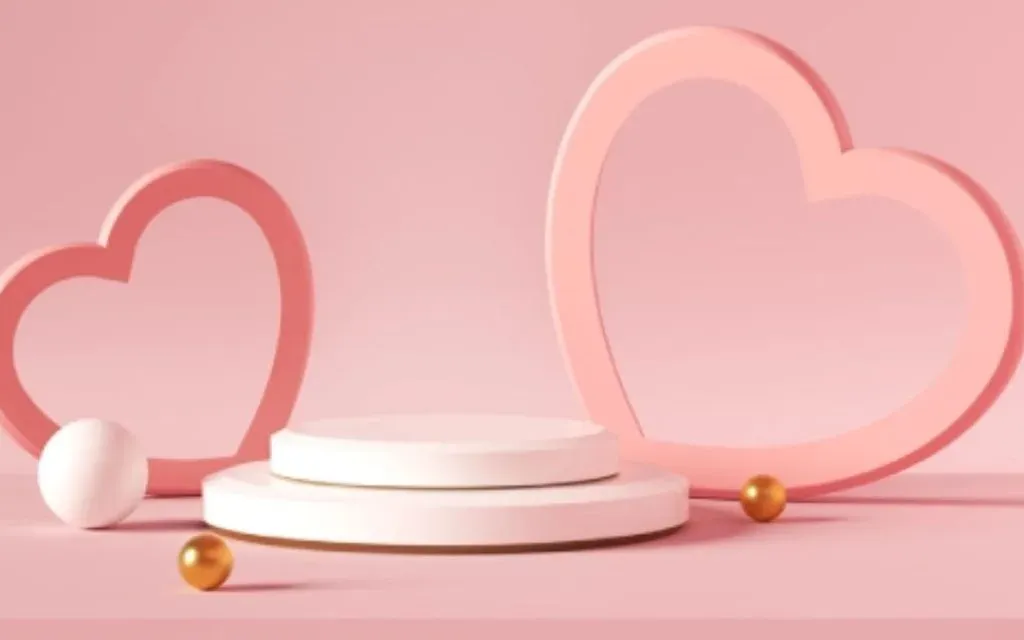 Two pink heart shapes and white display podiums with golden balls on a pink background