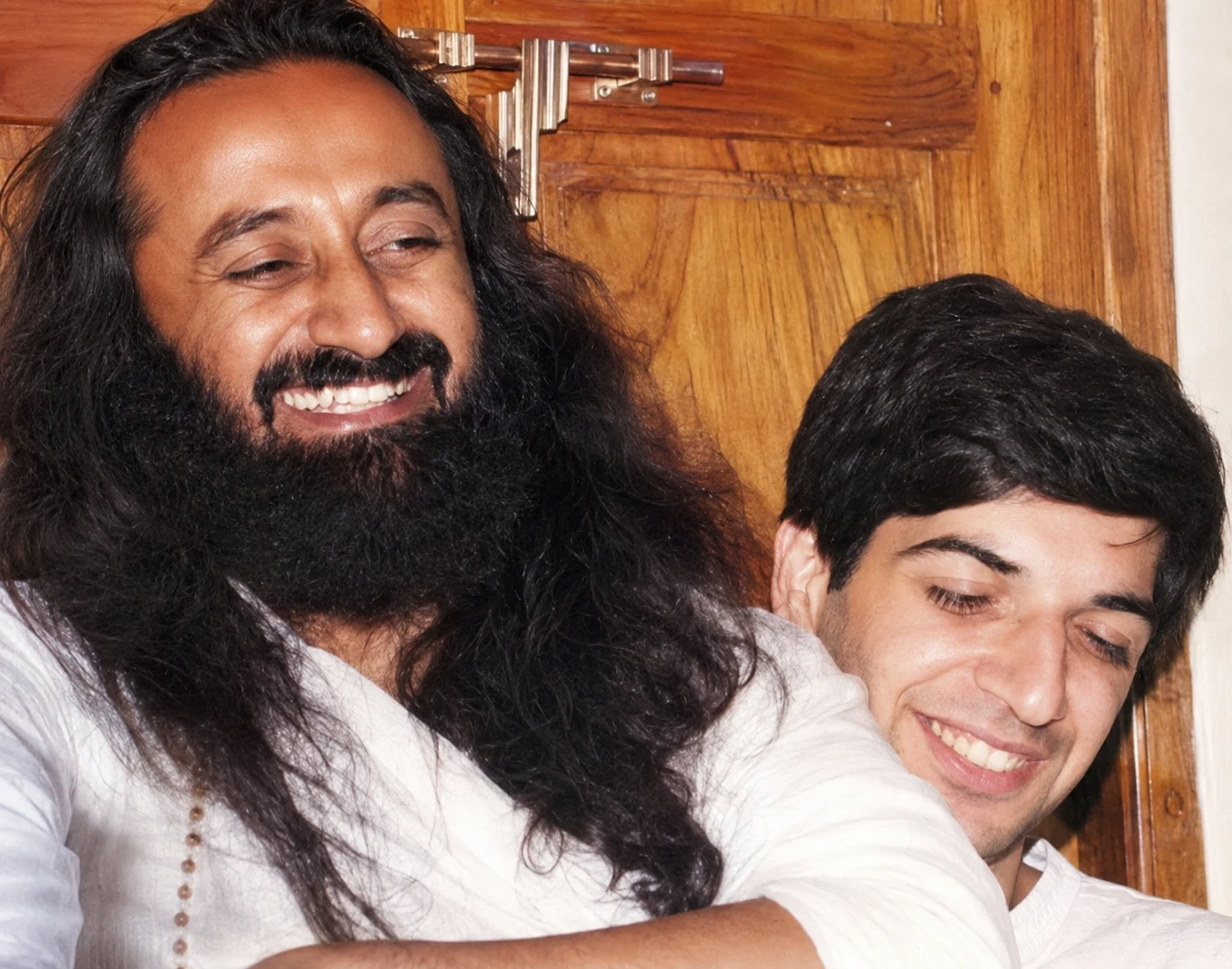 Bawa as a young man standing beside Gurudev, the first photograph Bawa had taken with Him