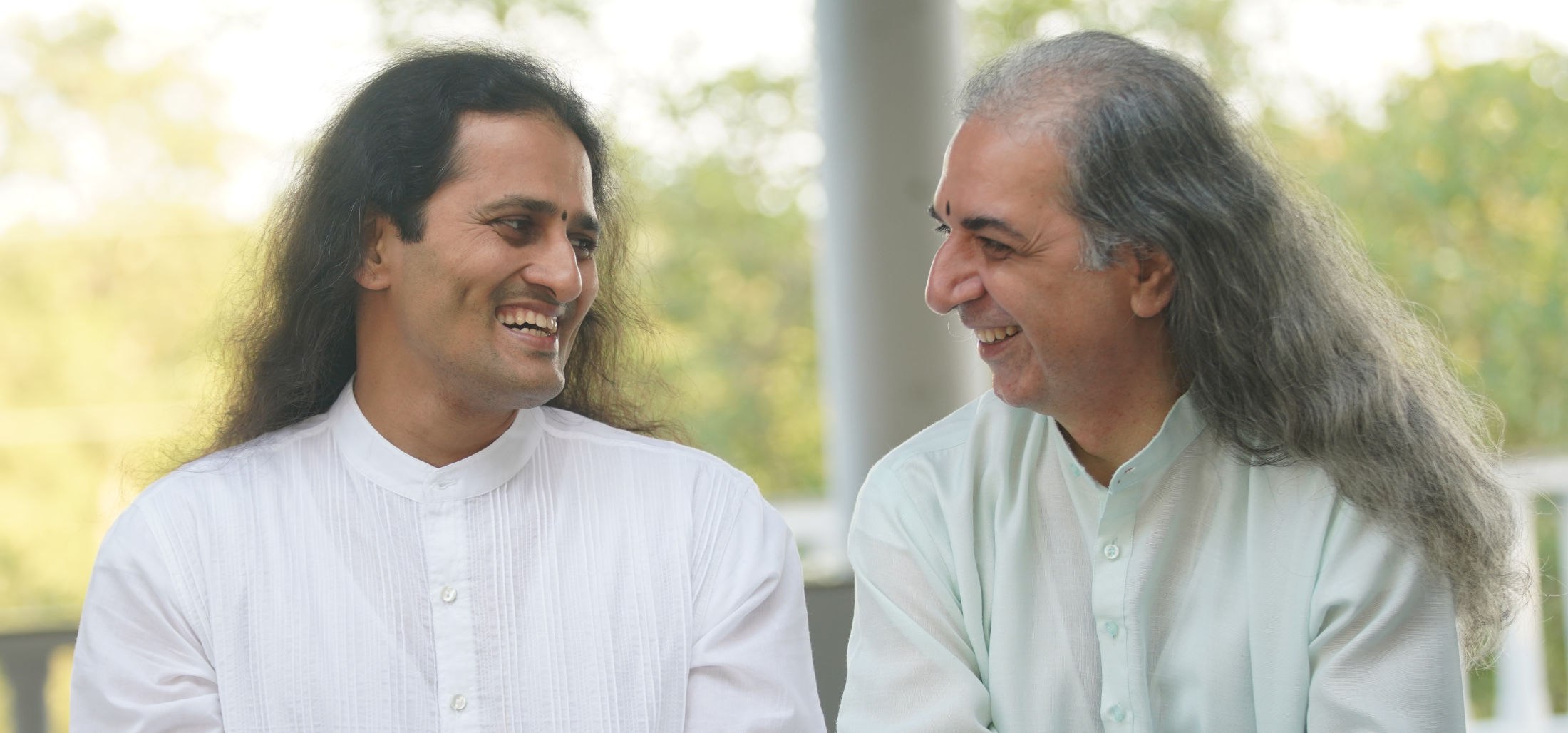 Bawa and Dinesh, laughing together