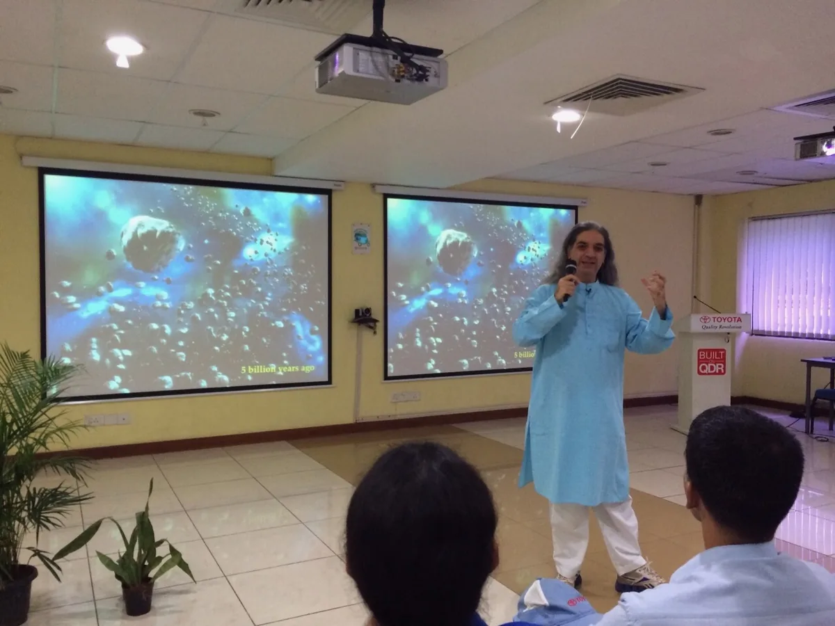 Bawa speaking in a company training room