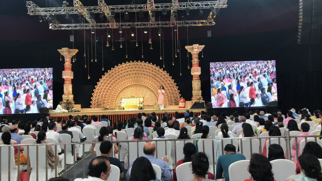On a large stage before a few thousand